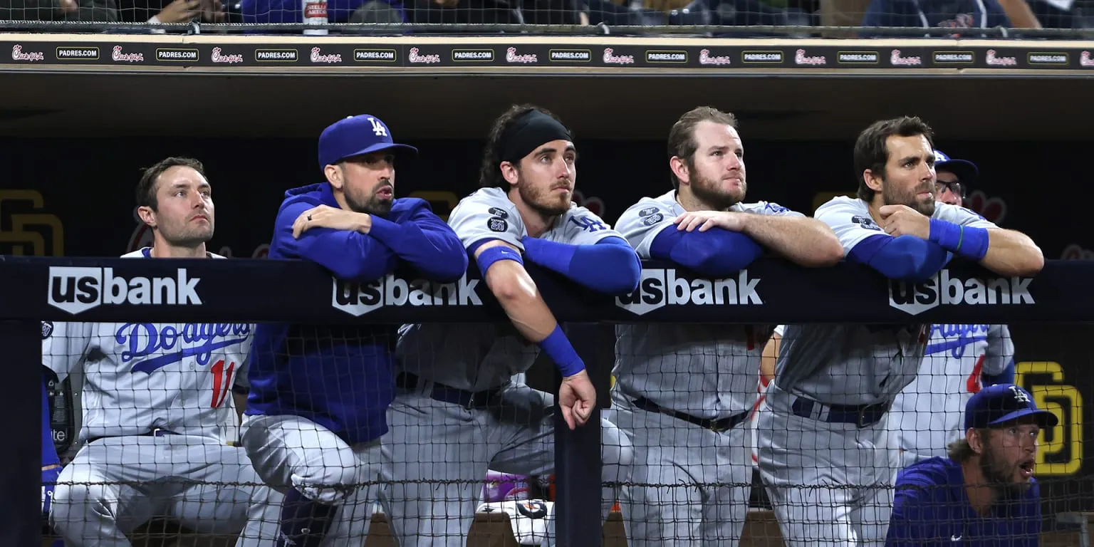 AJ Pollock, Cody Bellinger, Max Muncy, and Chris Taylor look on after a loss to the Padres.