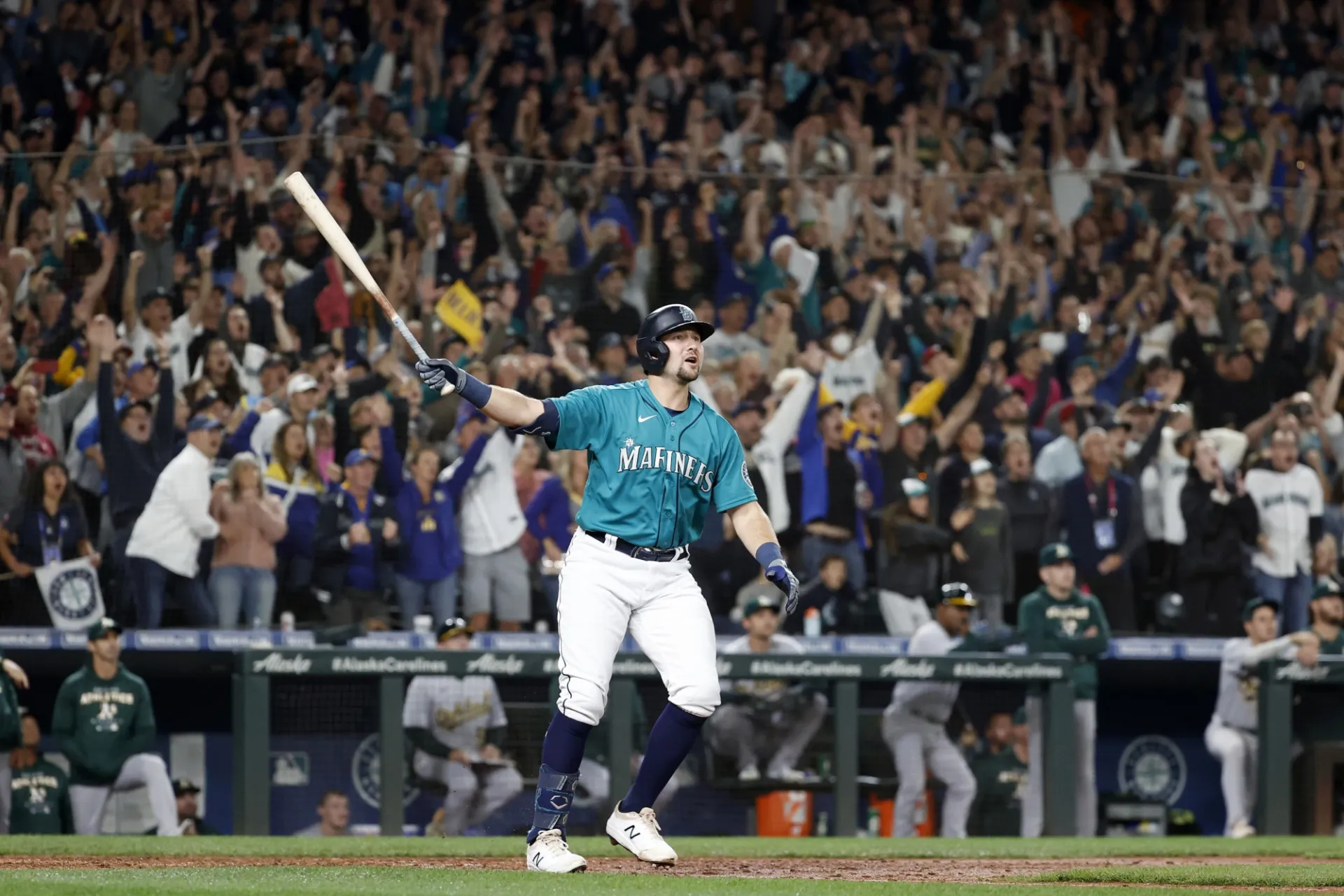 Cal Raleigh watches as his game-winning home run sends the Seattle Mariners to the playoffs for the first time since 2001.