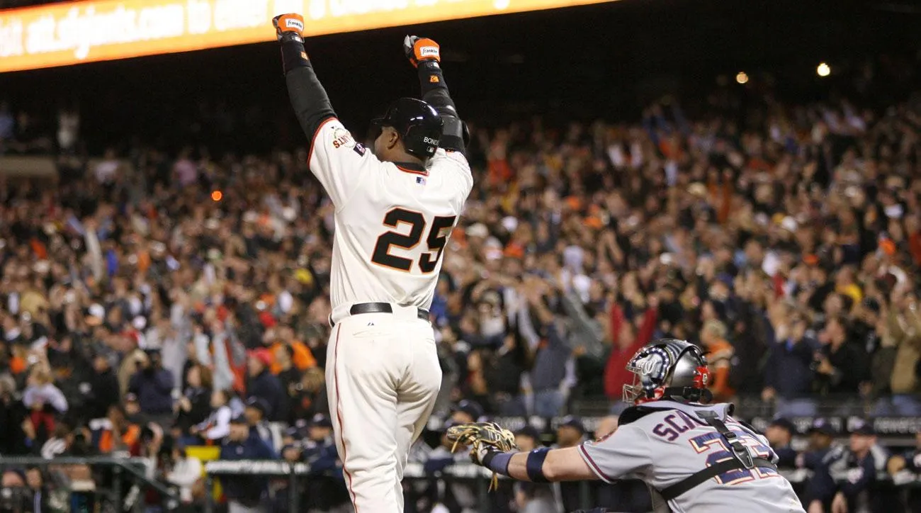 Barry Bonds celebrates after breaking Hank Aaron's career home-run record in 2007.