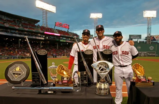 Mookie Betts, Jackie Bradley Jr., and J.D. Martinez receiving 2018 awards at Fenway Park.