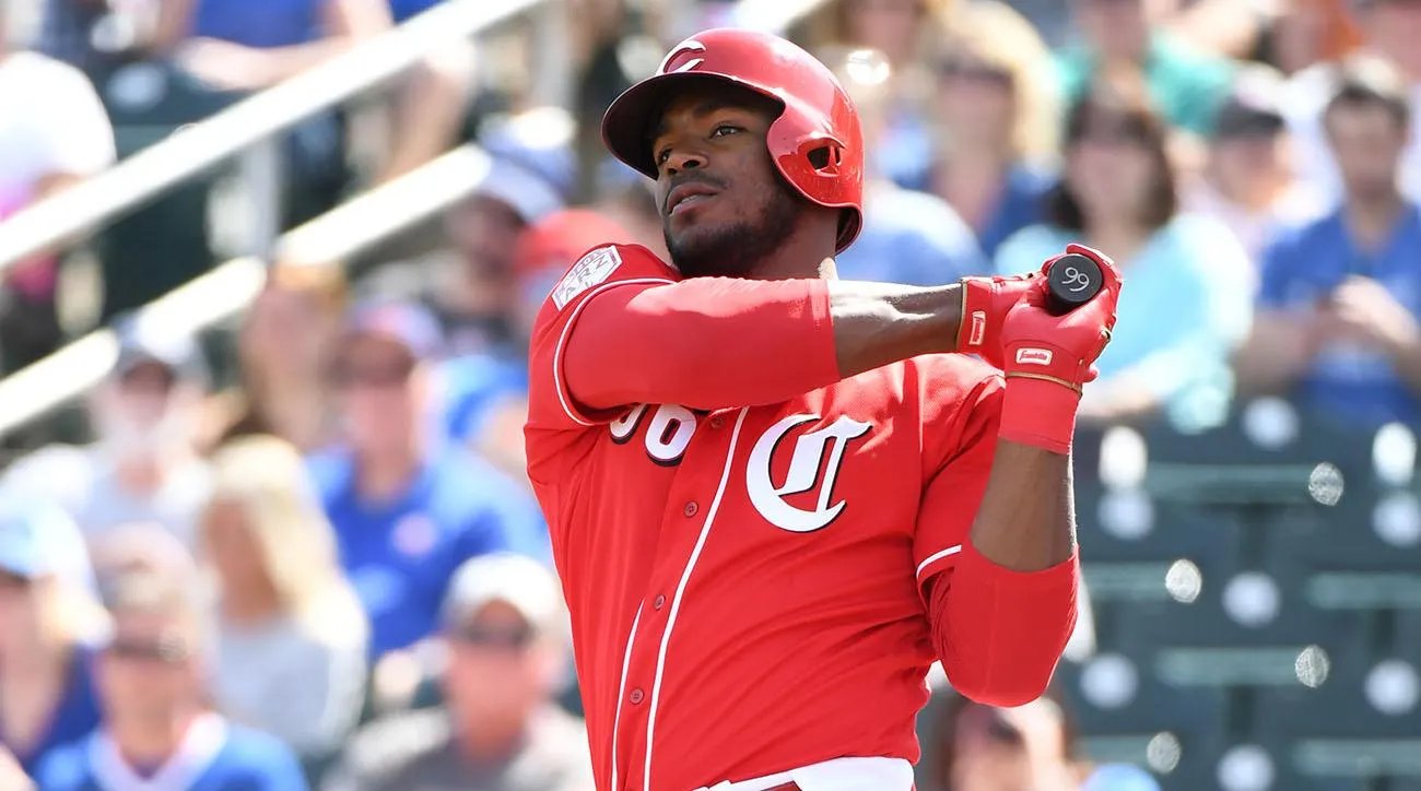 Yasiel Puig swinging a bat at Reds Spring Training in 2019
